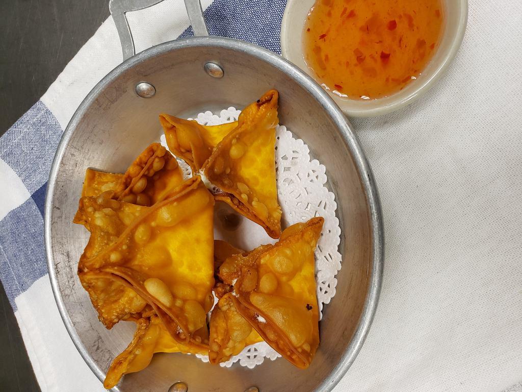 Crab Rangoon · Imitation crab meat with cream cheese, wrapped in wonton sheets and deep fried until golden brown. Served with sweet sauce.
