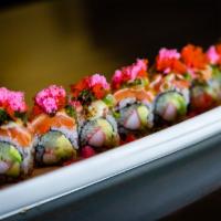 Parmigiano Roll Special · California roll, salmon, baked with Parmesan sauce, basil pesto, cod roe, scallion, and swee...