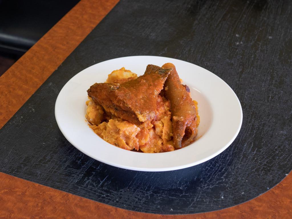 Yam Porridge · White tuber yam, cooked in tomatoes and spices, topped with pepper stew.