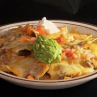 Nachos Mazatlan · Choice of chicken or beef, with cheddar cheese, chips, guacamole, sour cream and tomato.