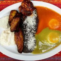 Huevos Divorciados · Two eggs made your way, one topped with green sauce and one with red sauce, separated with r...