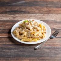 Penne Chicken Alfredo · Grilled chicken, bacon, onion, garlic and cracked black pepper in a Parmesan Alfredo sauce t...