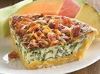 Bacon Quiche · A blend of cheeses, spinach and egg all baked in our famous, flaky crust. Topped with applew...