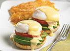 California Eggs Benedict. · Toasted English muffin topped with fresh avocado, tomatoes, poached eggs* and hollandaise sa...