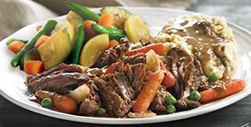 Braised and Slow-Roasted Pot Roast · Tender chunks of chuck roast slow-simmered for full flavor and tenderness, topped with a cab...
