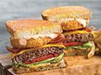 The Works Frisco Burger · Grilled parmesan sourdough piled high with crisp lettuce, tomato, pickles, aged American che...