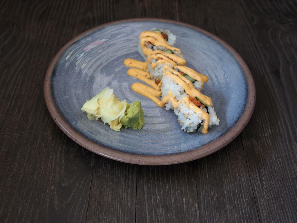 Spicy Salmon Roll · Salmon, cucumber, sesame and spicy mayo.