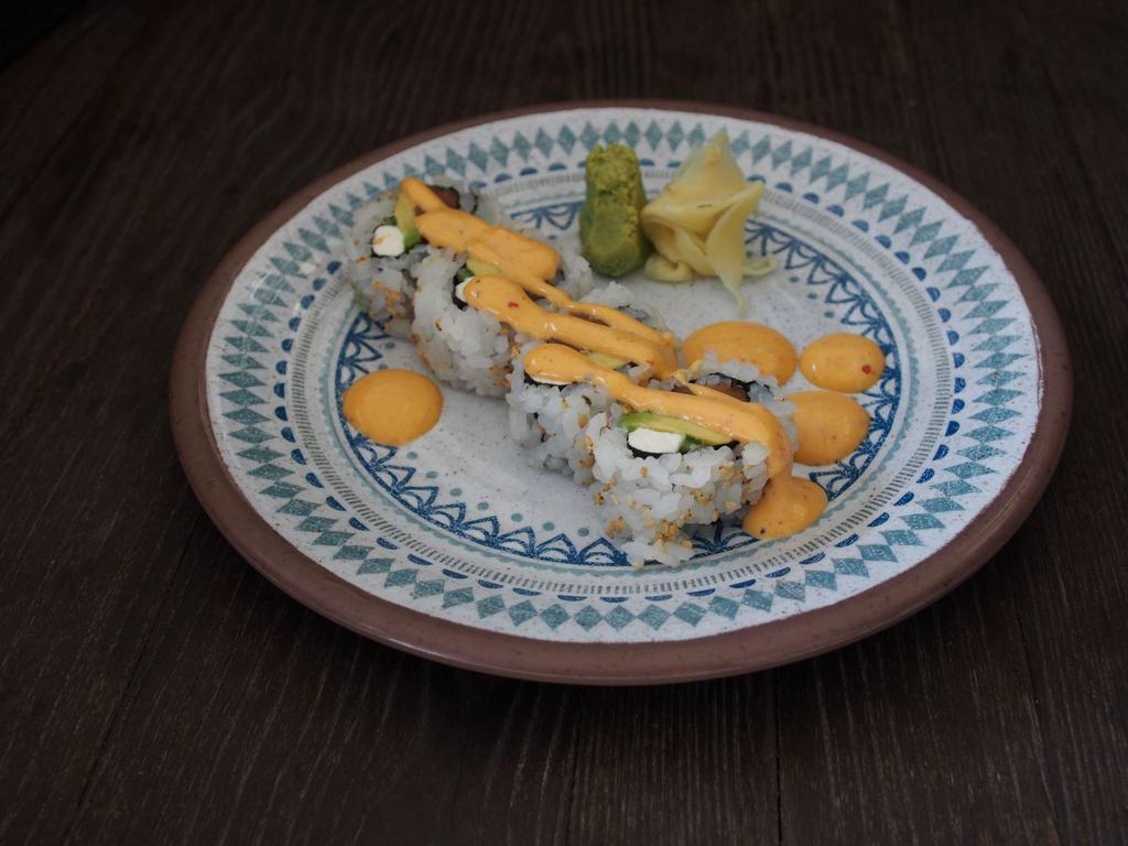 Tiger Eye Roll · Smoked salmon, avocado, cream cheese, serrano and spicy mayo. Gluten-free.
