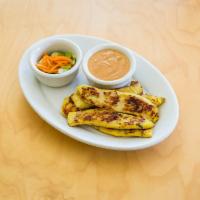 Chicken Satay (5) · Five marinated chicken strips broiled and served with Penny's homemade peanut sauce