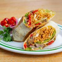Grilled Steak Burrito · Wrapped In A 12” Flour Tortilla With Peppers & Onions, Beans, Spanish Rice And Our 3 Cheese ...