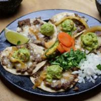 Tacos 1300 · 5 corn tortillas with beef, queso quesadilla, guacamole, and  onion, cilantro, lemon and car...