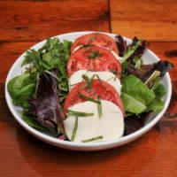 Caprese Stack Salad · Mixed greens, fresh mozzarella, sliced tomatoes, basil, with balsamic vinaigrette