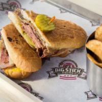 Classic Cuban Sandwich  · Roasted pork thinly sliced honey ham, Swiss cheese, bread and butter pickles and yellow must...