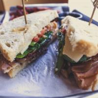 Turkey Jack Melt · Roasted turkey, pepper jack cheese, bacon, spinach, tomato, caramelized onions and tarragon ...