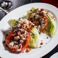 Iceberg Wedge Salad · Bacon, tomato and blue cheese