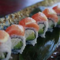 C7. Sunshine Roll · California roll with salmon and sliced lemons on top with mango sauce.