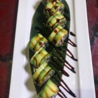 C23. Caterpillar Roll · Eel, kani and cucumbers with sliced avocado on top and eel sauce.