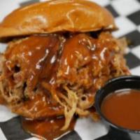 Pulled Pork Sammie · Pulled pork cooked with crushed red peppers and topped with our house BBQ.