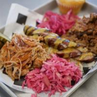 Smokers Club · Pulled pork, shredded beef brisket and beer braised brats over homemade sauerkraut topped wi...