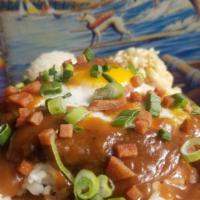 Loco Moco · Bed of rice with 1/2 lbs. hamburger patty. Topped with sunny up egg, Homemade brown gravy an...