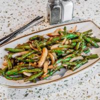 Spicy Green Beans · Wok seared green beans sauteed with onion and garlic in spicy szechuan sauce.