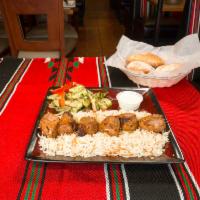 Lamb Kabob · Grilled marinated tender leg of lamb with spices, served with yogurt sauce.