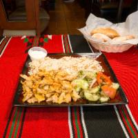 Chicken Shawarma Platter · Slowly roasted marinated chicken breast, served with rice, fattoush salad, and garlic sauce.