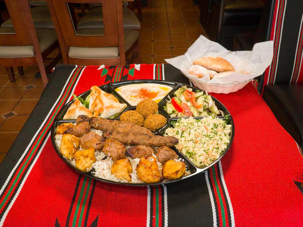 Family Combo 1 - Kabobs · 1 skewer lamb kabob, 1 skewer chicken kabob, 2 skewers kufta kabobs with rice, hummus, fattoush, couscous, 3 pieces of falafel, and 3 pieces of spinach pie feeds 3-4 people.