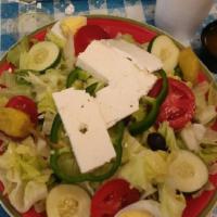 Greek Salad · Tomatoes, cucumber, onion, and olives.