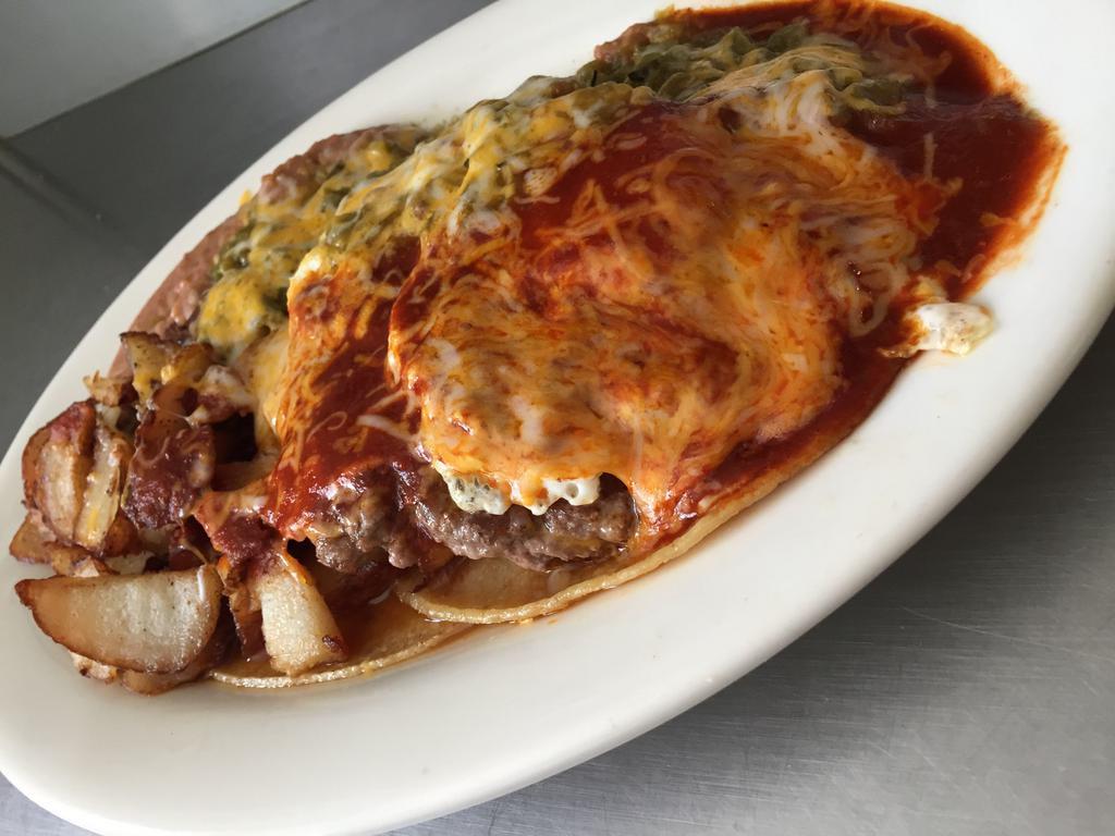 Burger Ranchero · 2 corn tortillas topped with a ground beef patty and 2 eggs, smothered with red or green chile, cheese and garnish.
