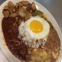 Monica's Favorite Enchilada Ranchera · 3 stacked corn tortillas topped with 1 egg, smothered with chile and a blend of Monterey and...
