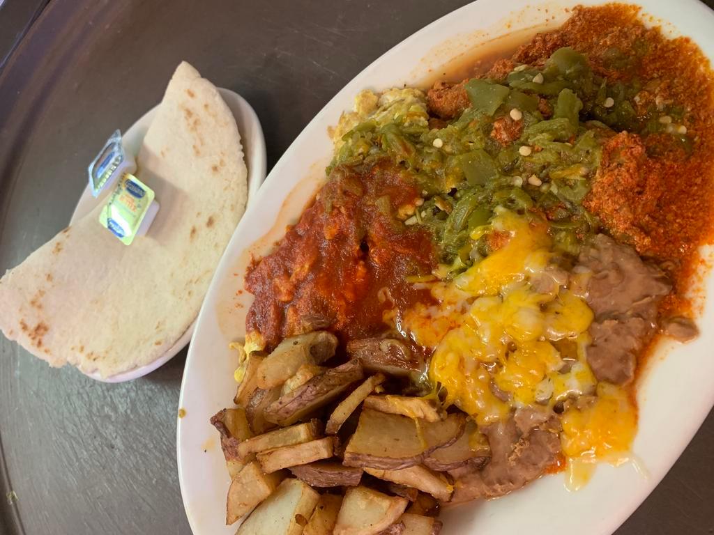 Carne Adovada and Eggs · Eggs cooked to order with a side of pork marinated in red chile.
