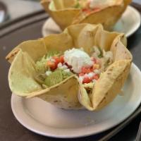 Taco Salad · Crispy tortilla filled with whole beans, ground beef and chile or salsa, lettuce, tomato and...