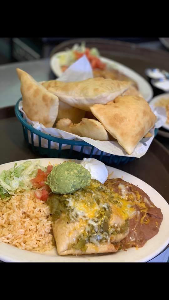 Chimichanga · Thin flour tortilla filled with choice of shredded chicken, roast beef or carne adovada deep-fried smothered with choice of chile, cheese with guacamole and sour cream.