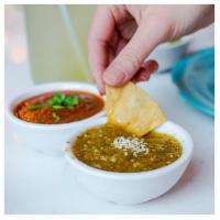 Salsa · our house duo, salsa roja topped with cilantro and a salsa verde topped with sesame seeds