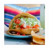 Beef Taco · Ground beef in a puffy shell with cheese, lettuce, & tomato