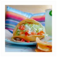 Chicken Taco · Grilled chicken in a puffy shell with cheese, lettuce, & tomato