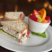 Tarragon Chicken Salad Sandwich  · Tarragon Chicken, Tomato, lettuce, herb mayo on sourdough bread. Served with a choice of sid...