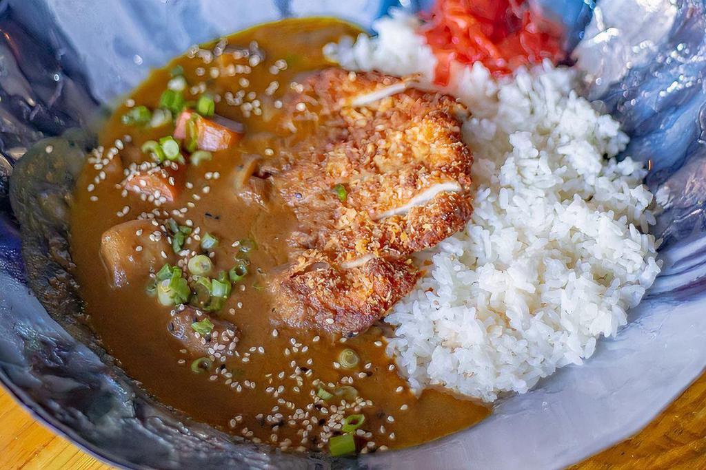 Chicken Katsu Curry* · Chicken katsu over rice, topped with our house curry simmered with our assorted vegetables.