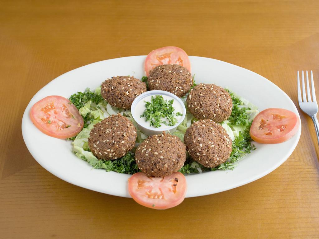 Falafel · Vegetable patties. Six fried patties made with fava beans and chickpeas. Served with tomatoes and tahini (sesame sauce).