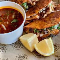 Birria Queso Tacos · Three Birria tacos, melted cheese, tortillas dipped and grilled in aus jus, onion, cilantro....