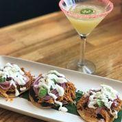 Tinga Tostaditas · Pulled chicken, smoky chipotle, black bean puree, avocado, crumbled queso fresco, cream, and...