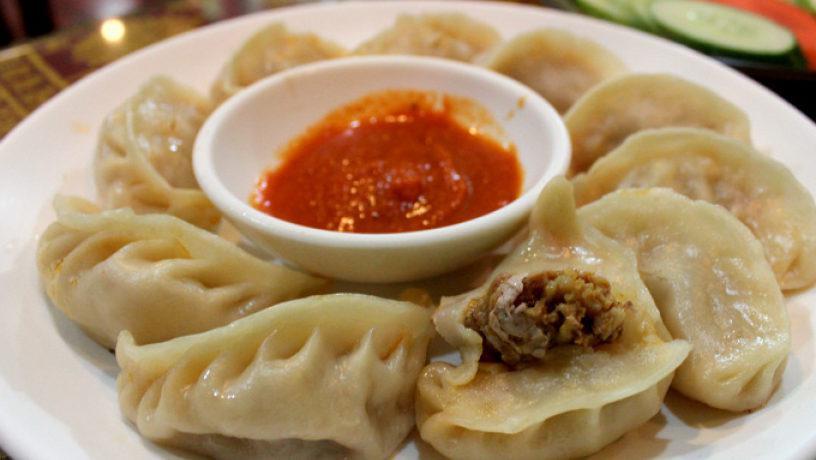 Chicken Momos · Ginger, garlic, onions and spicy tomato sauce.