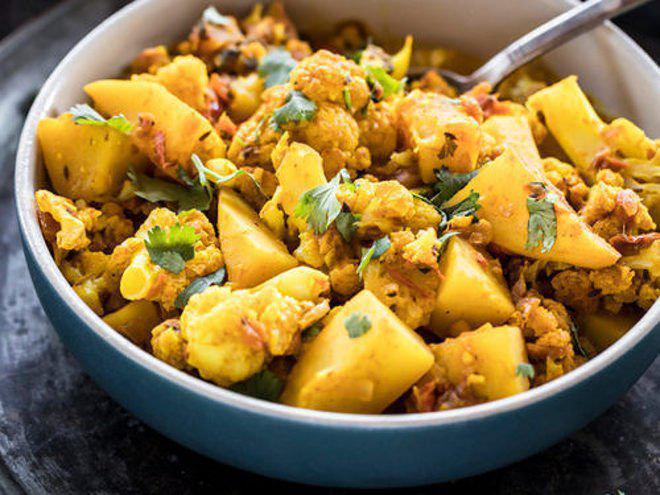 Aloo Gobi  · Combination of cauliflower and potato in an onion-tomato based curry-spiced the Indian way. Includes serving of rice.