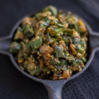 Okra · Okra and dry mango. Served semi-dry. Includes serving of rice. Vegetarian.