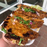 Quesa Taco Birria · Crispy taco with Cheese, birria, onion, and cilantro
