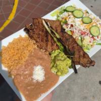 El Duranguense  · Grilled carne asada, rice , beans, guacamole, tortillas, garden salad and chips and salsa 