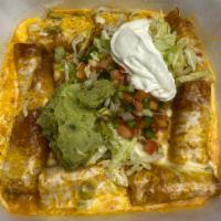 Taquitos · Deep-fried corn tortilla filled with shredded chicken. Smothered with green chili.