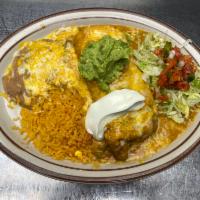 Chimichangas · Chicken, beef, carnitas or shredded beef chimichanga, smothered with green chile, served wit...