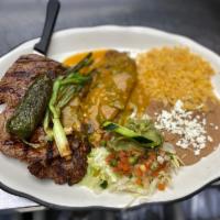 Dos Amigos · Smothered 8 oz. skirt steak, and chile relleno (soft or crispy).